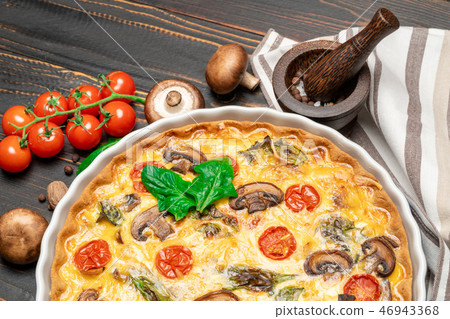 Baked homemade quiche pie in ceramic baking form 46943368
