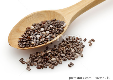 Chia seeds and wooden spoon Chia seeds and wooden spoon 46944210