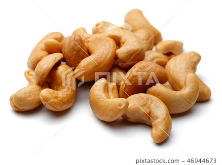 Roasted cashew nuts on white background Roasted cashew nuts on white background 46944673