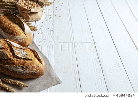 Still life with bread, flour and spikelets Still life with bread, flour and spikelets 46944884