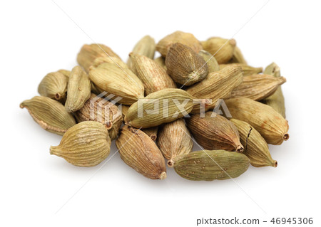 Heap of cardamom pods on white background Heap of cardamom pods on white background 46945306