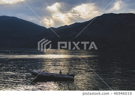 Dramatic sunset over Garda Lake in Italy Dramatic sunset over Garda Lake in Italy 46946019