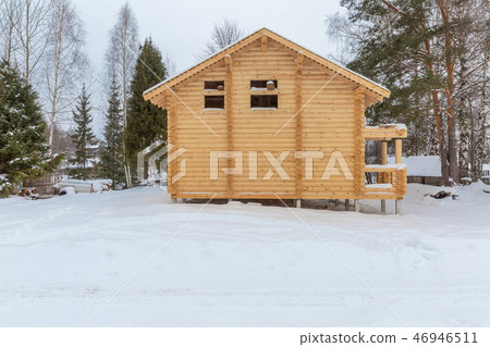 facade of a wooden house under construction facade of a wooden house under construction 46946511