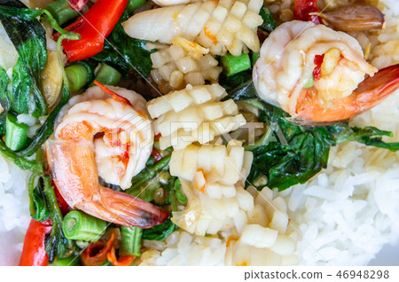 Fried basil shrimp with squid topped with rice 46948298