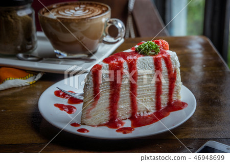 strawberry crape cake on wood table in coffee strawberry crape cake on wood table in coffee 46948699