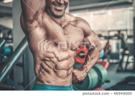 Brutal aged strong bodybuilder athletic men pumping up muscles w Brutal aged strong bodybuilder athletic men pumping up muscles w 46949000