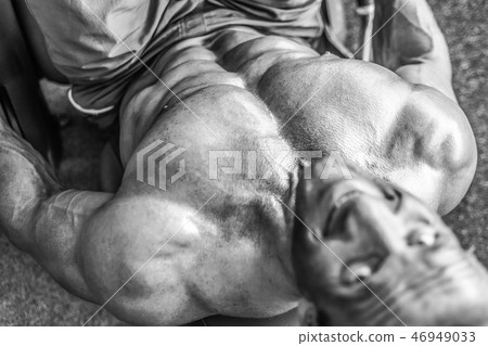 Brutal aged strong bodybuilder athletic men pumping up muscles w 46949033
