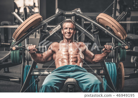 Brutal aged strong bodybuilder athletic men pumping up muscles w Brutal aged strong bodybuilder athletic men pumping up muscles w 46949195