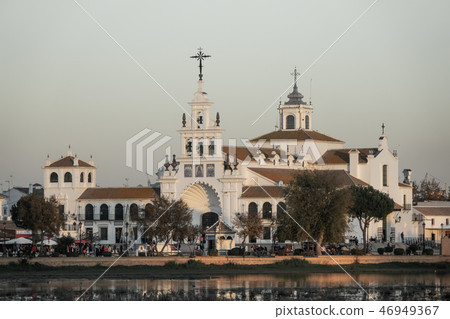 El Rocio church and crowded streets with many tourists El Rocio church and crowded streets with many tourists 46949367