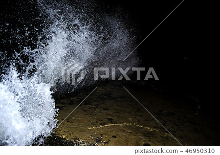 Splashing wave on the Black sea in the night. Splashing wave on the Black sea in the night. 46950310