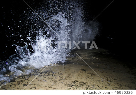 Splashing wave on the Black sea in the night. 46950326