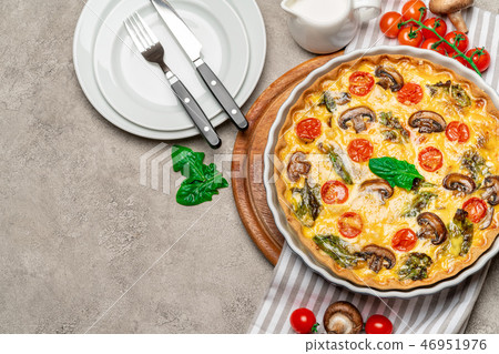Baked homemade quiche pie in ceramic baking form Baked homemade quiche pie in ceramic baking form 46951976
