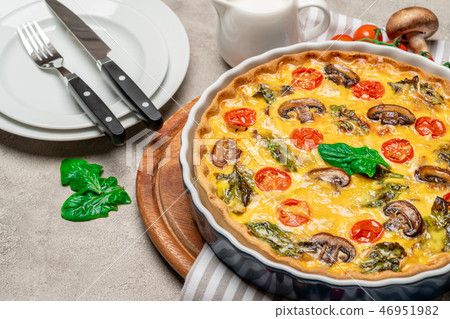 Baked homemade quiche pie in ceramic baking form 46951982