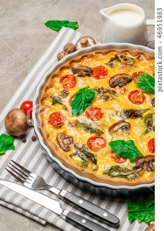 Baked homemade quiche pie in ceramic baking form Baked homemade quiche pie in ceramic baking form 46951983