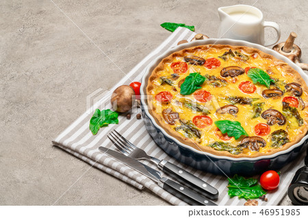 Baked homemade quiche pie in ceramic baking form Baked homemade quiche pie in ceramic baking form 46951985