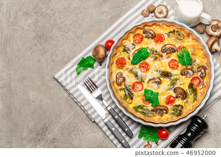 Baked homemade quiche pie in ceramic baking form Baked homemade quiche pie in ceramic baking form 46952000