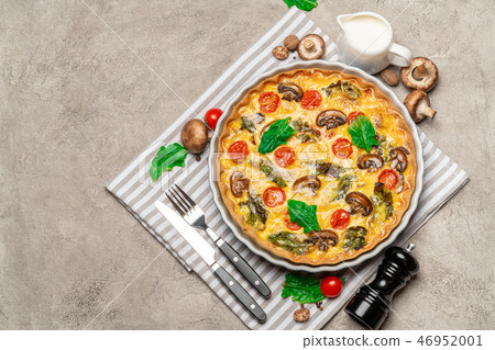 Baked homemade quiche pie in ceramic baking form Baked homemade quiche pie in ceramic baking form 46952001