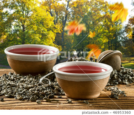Two cups of tea in the autumn landscape Two cups of tea in the autumn landscape 46953360