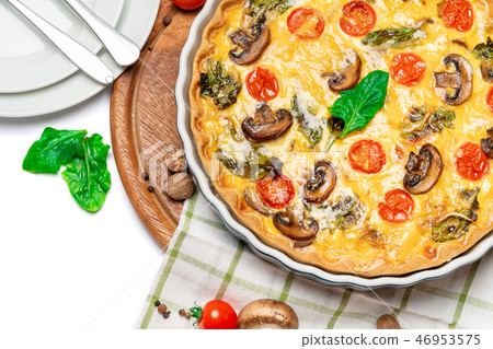 Baked homemade quiche pie in ceramic baking form Baked homemade quiche pie in ceramic baking form 46953575