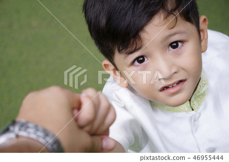 Asian student boy hold father's hand go to school. Asian student boy hold father's hand go to school. 46955444