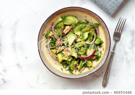 A bowl with tuna fish and avocado salad 46955486