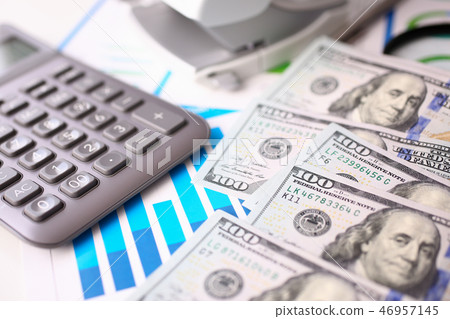 Silver calculator with gray keyboard is lying Silver calculator with gray keyboard is lying 46957145
