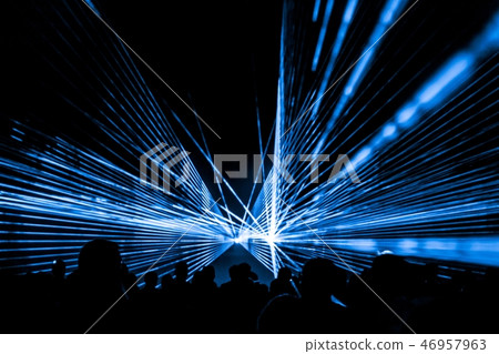Blue laser show nightlife club and party people Blue laser show nightlife club and party people 46957963