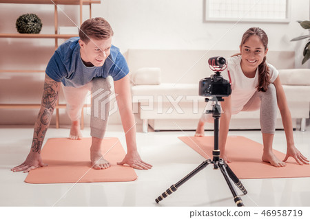 Tatooed man exercising with a woman 46958719