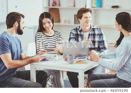 Smart young people discussing a startup Smart young people discussing a startup 46959199