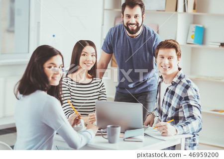 Pleasant joyful students looking at you Pleasant joyful students looking at you 46959200