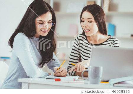 Delighted nice students taking notes 46959555