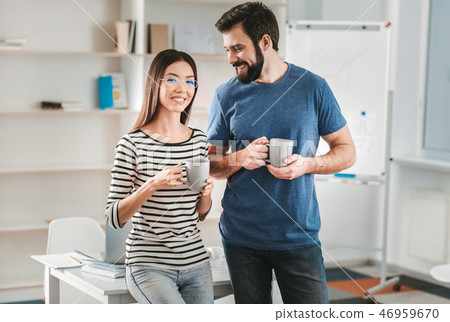 Couple of promising businessmen standing in their new office 46959670