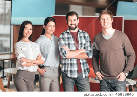 Pleasant happy students standing together Pleasant happy students standing together 46959940