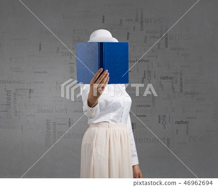 Woman hiding face behind book 46962694