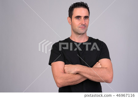 Portrait of handsome man against white background 46967116