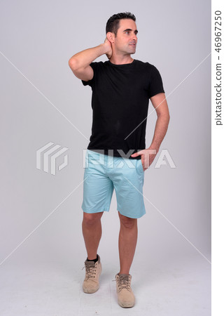 Full body shot of handsome man against white background Full body shot of handsome man against white background 46967250
