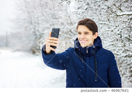tourist makes selfie in winter forest 46967681