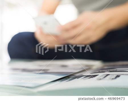 Man's hands holding and working with smart phone Man's hands holding and working with smart phone 46969473