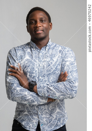 portrait of black young man standing with bent arms isolated on white background portrait of black young man standing with bent arms isolated on white background 46970242