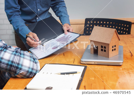 Real estate agent showing his client about propert 46970545
