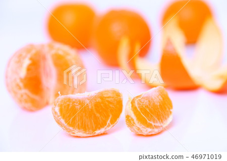Peeled orange white background Peeled orange white background 46971019