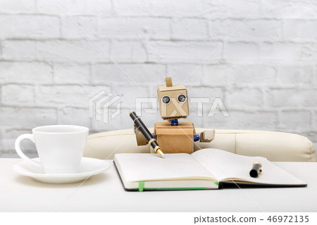 robot is sitting at the table, working place robot is sitting at the table, working place 46972135