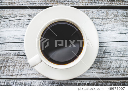 Cup of dark coffee. 46973007