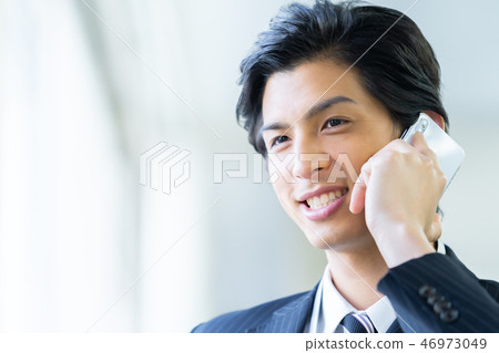 Male employee who calls a young businessman 46973049