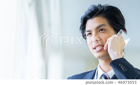 Male employee who calls a young businessman 46973053