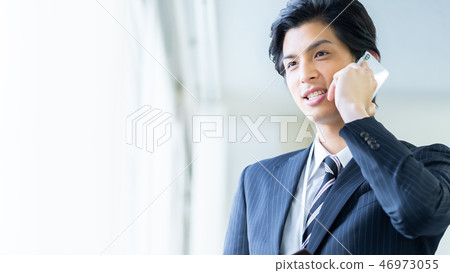 Male employee who calls a young businessman Male employee who calls a young businessman 46973055