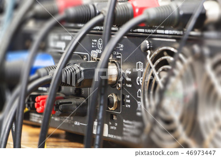 audio jack and wires connected to audio mixer 46973447