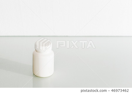 White medical container on light gray background White medical container on light gray background 46973462
