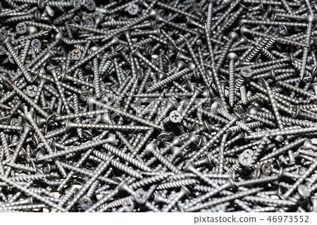 focus on center. black screws texture background  46973552