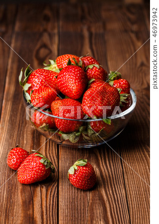 Bowl with fresh strawberries 46973942